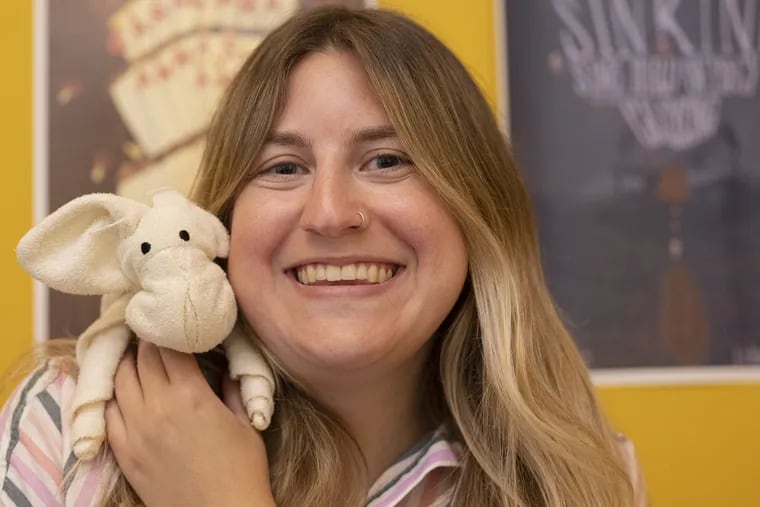 Amanda Schwarz, 27, of East Passyunk, and her favorite stuffed animal, a pig named Paul. Schwarz and her boyfriend will soon move in together. The question: Will her boyfriend accept Paul the pig? Many adults in the U.S. sleep with stuffed animals, part of a trend that has made Squishmallows wildly popular.