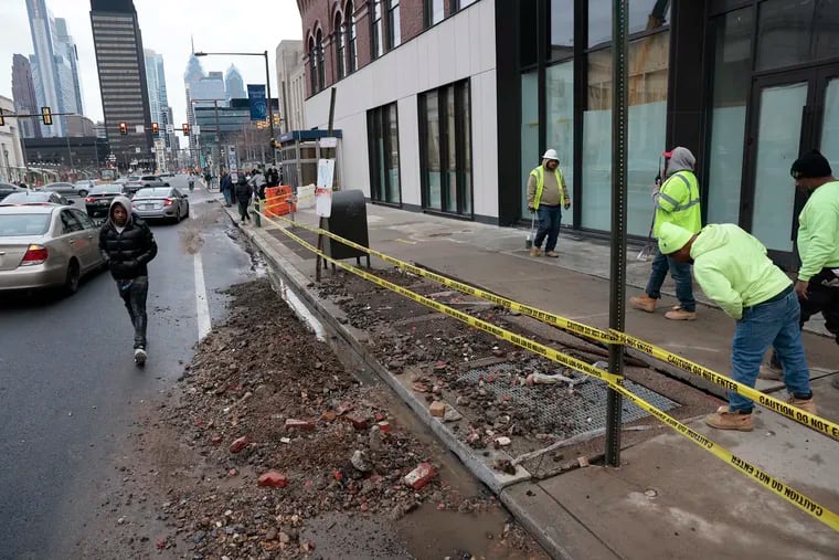 The scene of a water leak on Market Street outside 30th Street Station that caused flooding and disrupted SEPTA subway and trolley service Sunday.