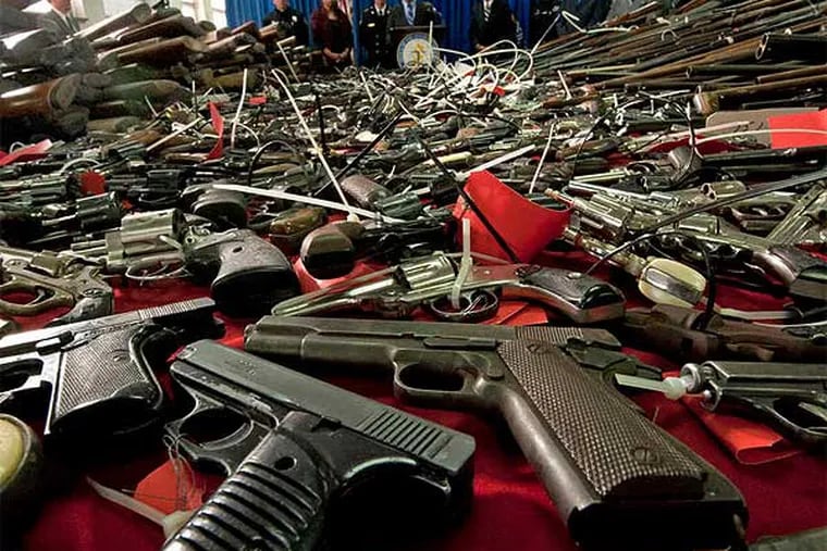 Some of the 1,337 guns turned in during a two-day gun buyback program in Camden County last month. (April Saul / Staff Photographer)