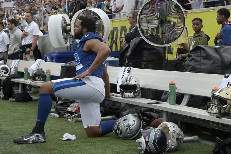 New Eagles defensive end Michael Bennett kneels during the national anthem at the 2018 Pro Bowl as a member of the Seattle Seahawks. The NFL will fine teams next season if players kneel on the sideline.