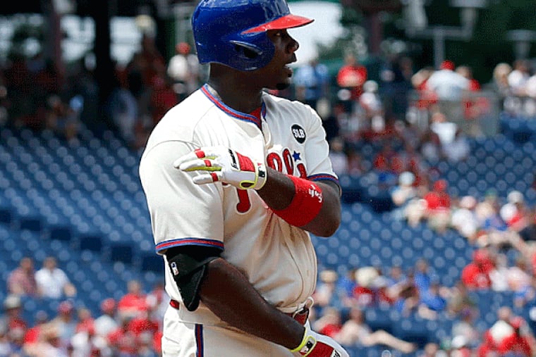 Ryan Howard tosses his bat after striking out swinging to
end the first-inning. (Yong Kim/Staff Photographer)