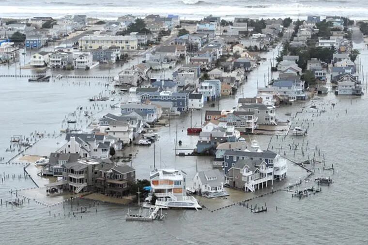 Portion of West 27th Street in Ship Bottom, N.J., on Long Beach Island is underwater Tuesday, Oct. 30, 2012, a day after Hurricane Sandy blew across the New Jersey barrier islands. ( CLEM MURRAY / Staff Photographer )
