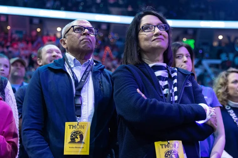 Penn State President Neeli Bendapudi (right) and her husband, Venket Bendapudi, are on stage mid-February during THON, Penn State's annual 46-hour dance marathon to raise money for pediatric cancer research and family support.