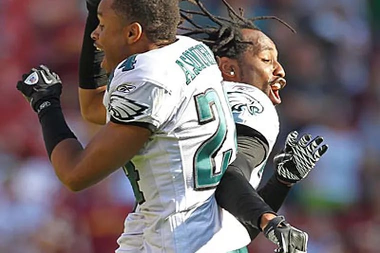Nnamdi Asomugha and Asante Samuel celebrate a fourth-quarter first down that sealed the win. (Michael Bryant/Staff Photographer)