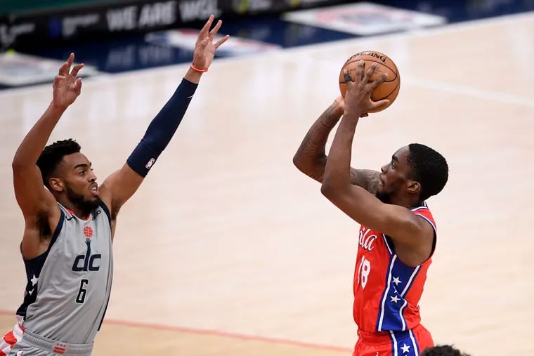 Philadelphia 76ers guard Shake Milton (18) shoots against Washington Wizards forward Troy Brown Jr. (6) during the second half of an NBA basketball game, Friday, March 12, 2021, in Washington. The 76ers won 127-101.