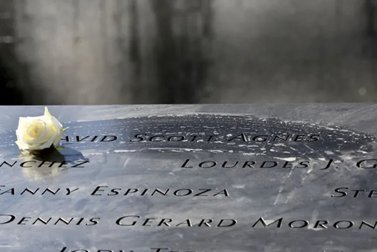 A rose is placed next to the name of a victim of the terrorist attacks on the World Trade Center at the North Pool of the National September 11 Memorial and Museum. The U.S. Supreme Court gave the go-ahead Monday to a lawsuit by victims of the Sept. 11, 2001, attacks against the government of Saudi Arabia, alleging it indirectly financed al Qaeda in the years before the hijackings.
