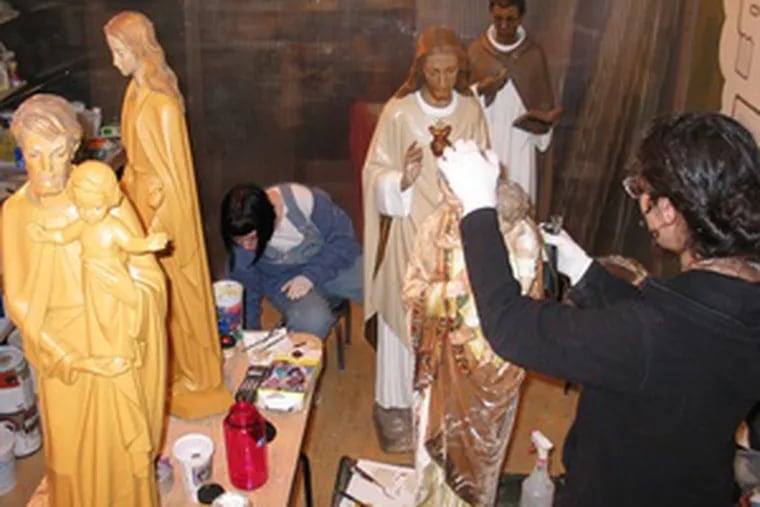 In Georgina Ferrandi&#0039;s Saints Alive Studio in New York, she and Leslie Harding repair statues. Ferrandi has a master&#0039;s degree in sculpture.