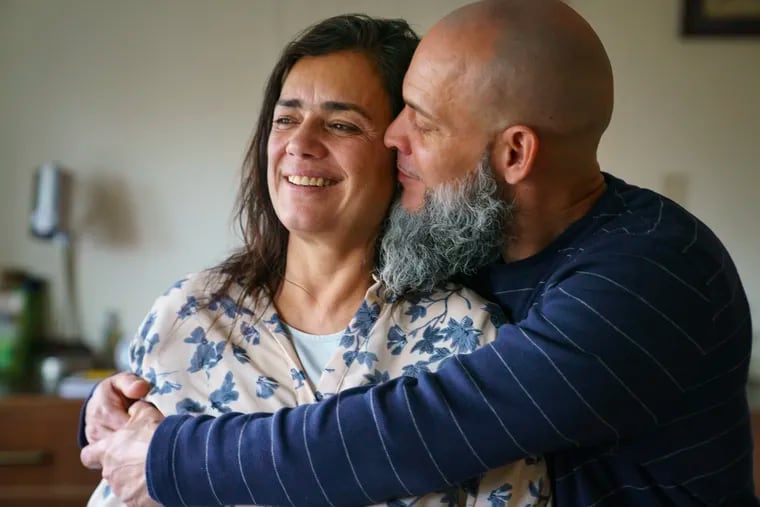 Luz Cordero, left, and Richard Ruiz, right, who had been living in an homeless encampment on Vine Street,  are shown here in their room at a Project HOME residence, in Philadelphia, Friday, Jan. 10, 2020.