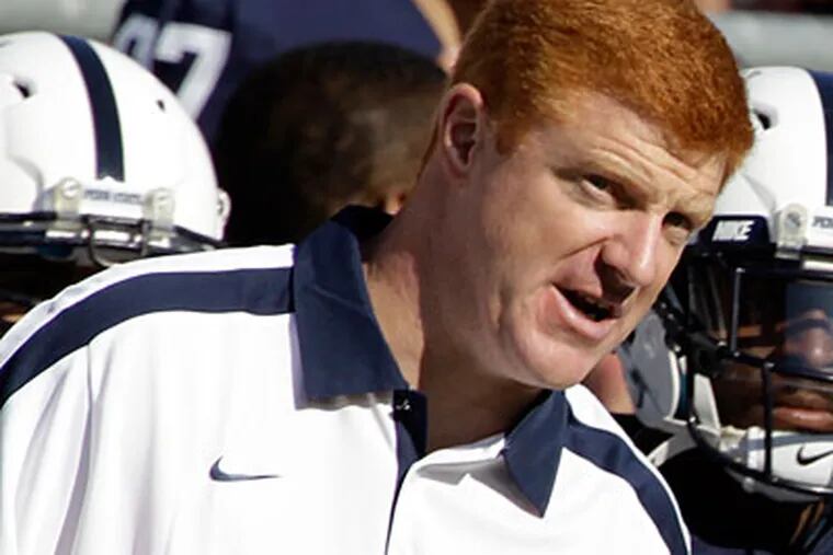 Penn State assistant coach Mike McQueary was placed on administrative leave on Friday. (Gene Puskar/AP)