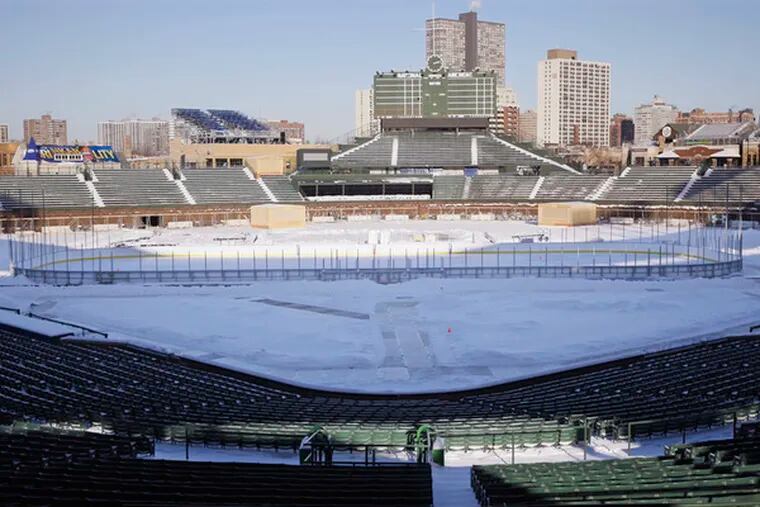 Workers transform Wrigley Field into an ice rink for the New Year&#0039;s Day matchup between the Chicago Blackhawks and the Detroit Red Wings. This is the NHL&#0039;s third Winter Classic.