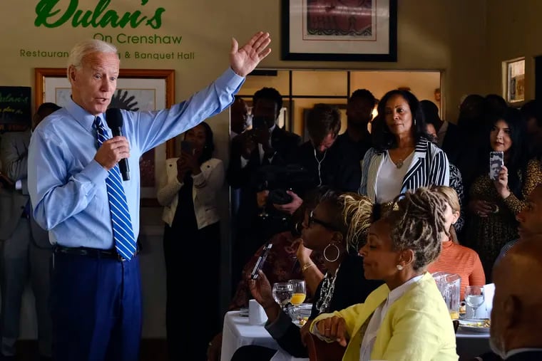 FILE - In this July 18, 2019, file photo, Democratic presidential candidate former Vice President Joe Biden speaks to community faith leaders after serving breakfast during a visit to Dulan's Soul Food on Crenshaw in Los Angeles. More than traditional markers of electability like name recognition, fundraising ability or charisma, the path to the Democratic nomination runs through black voters.  (AP Photo/Richard Vogel, File)