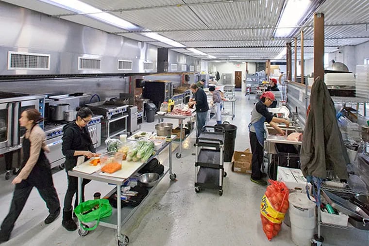 Food truck chefs preparing food in the Bridesburg Commissary, Philadelphia, January 19, 2014.  ( DAVID M WARREN / Staff Photographer )