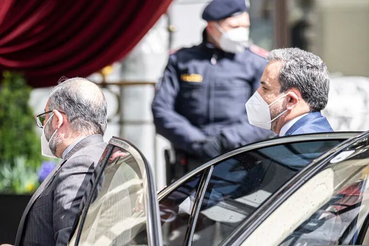 Political deputy at the Ministry of Foreign Affairs of Iran Abbas Araghchi, right, arrives Tuesday at the Grand Hotel Wien in Vienna, where closed-door nuclear talks take place.