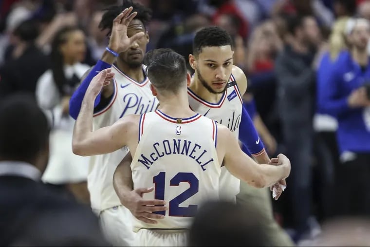 Sixers Ben Simmons and T.J. McConnell celebrate after the Game 4 triumph.