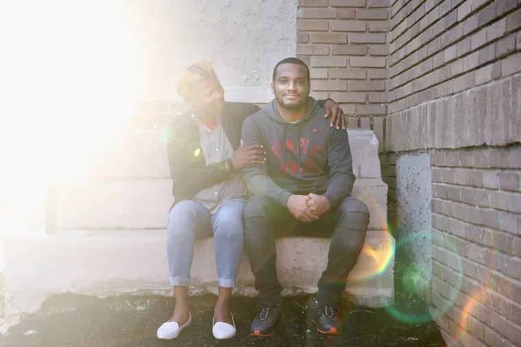 Hazim Hardeman, right, and his mother, Gwendolyn, sit for a portrait outside their West Philadelphia apartment on Tuesday, Sept. 18, 2018. Hazim Hardeman is Temple University's first Rhodes Scholar.