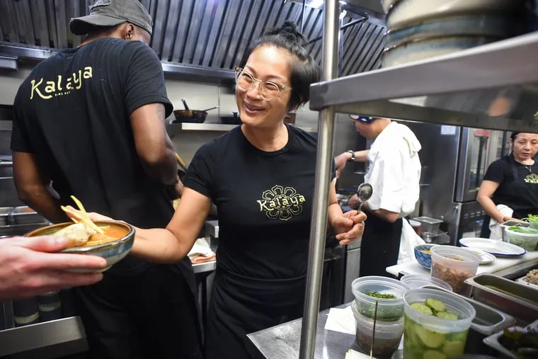 Chef and co-owner Nok Suntaranon hands off an order to the waitstaff, if the kitchen at Kalaya Authentic Thai Kitchen 764 S 9th St., July 17, 2019.