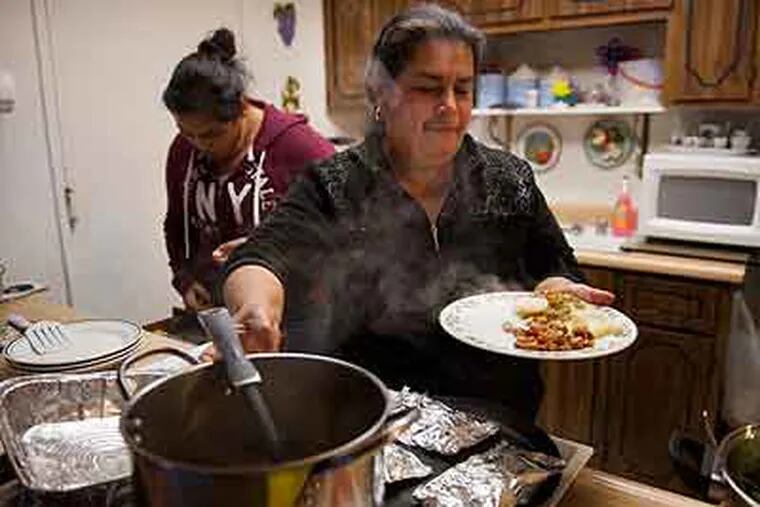 Maria Medina serves up a healthy meal for her family at their home in  Rancho Cordova in Sacramento, Calif. Adapting a diet - for her and for her family - is giving them a chance to reduce their risk of getting diabetes. (Autumn Cruz / Sacramento Bee / MCT)