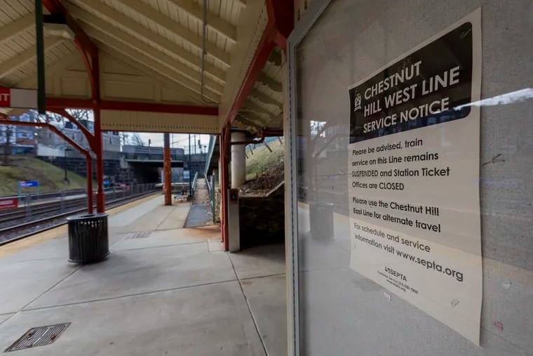 A service notice at an empty Queen Lane Station in January informed riders that the Chestnut Hill West Line had been suspended. Service resumed Monday.