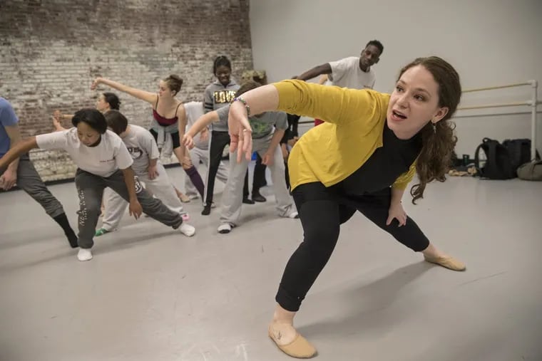 During rehearsal this spring, choreographer Jessica Kilpatrick, right, shows a combined ensemble of Pennsylvania Ballet II dancers and St. Katherine Day School students  how she wants them to move in their performance of “I Am.” Their collaboration is the subject of a new documentary.