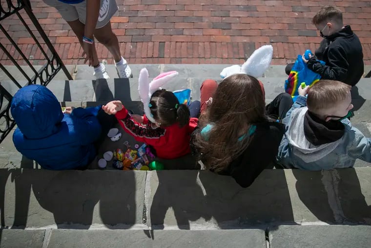 Kids open up their Easter eggs at Calvary Christian Church in Northeast Philadelphia on April 3. New cases of COVID-19 have been trending younger for weeks across the country and locally.