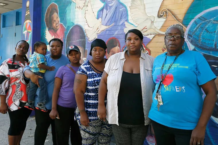 “Our school needs help,” says Shereda Cromwell, whose children attend Kenderton Elementary, where parents say they feel lost. From left: Tinze James, Octavia Abney, Ty-Shone Mitchell, Debra Eddy, Tasha Mitchell, Cromwell, Lorraine Falligan.
