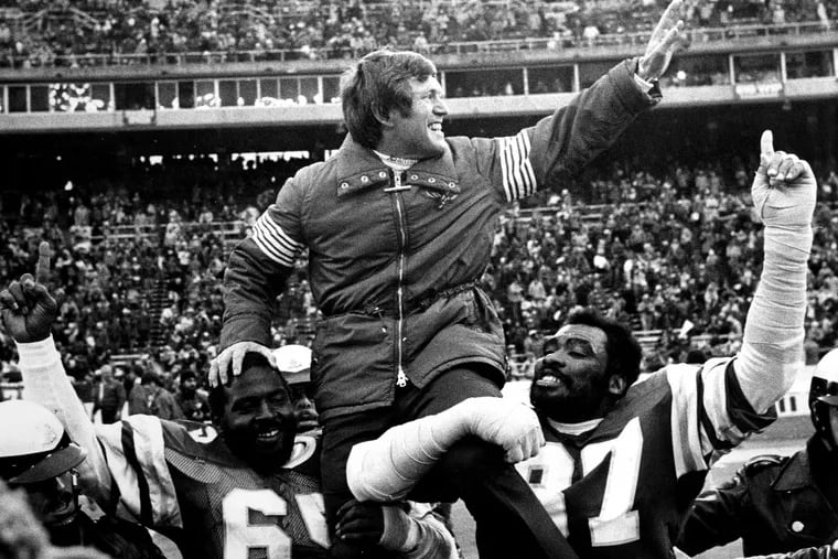 Fomer Eagles coach Dick Vermeil is carried off the field by Charlie Johnson (No. 65) and Claude Humphrey (No. 87) folllowing the team’s 1981 NFC championship victory over the Dallas Cowboys.