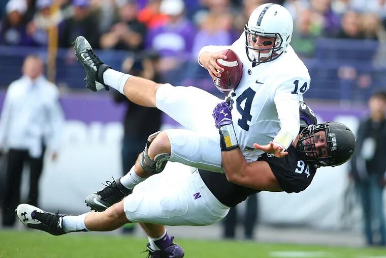 Northwestern Wildcats defensive lineman Dean Lowry (94) is penalized after tackling Penn State Nittany Lions quarterback Christian Hackenberg (14) during the first quarter at Ryan Field.