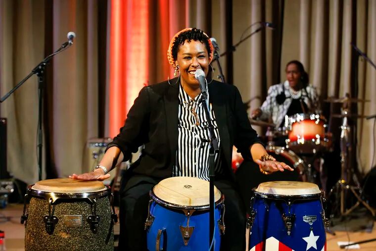 LaTreice Branson plays the congas during her Drum Like a Lady performances at the Great Stair Hall at the Philadelphia Museum of Art.