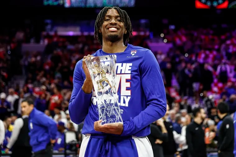 Sixers guard Tyrese Maxey holds the NBA Most Improved Player Award before Game 3 of his team's first-round series against the Knicks.