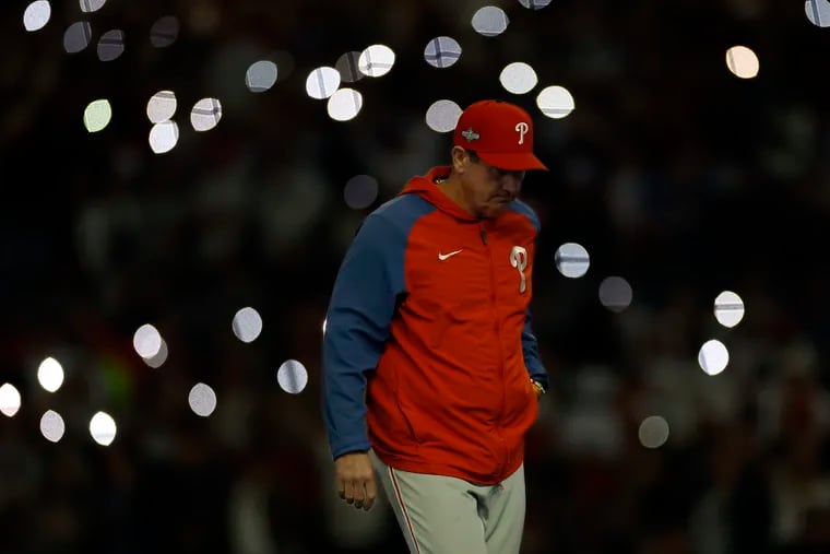 Philadelphia Phillies manager Rob Thomson walks back to the dugout after he replaced relief pitcher Jose Alvarado during the eighth inning in Game 2 of a National League Division Series.