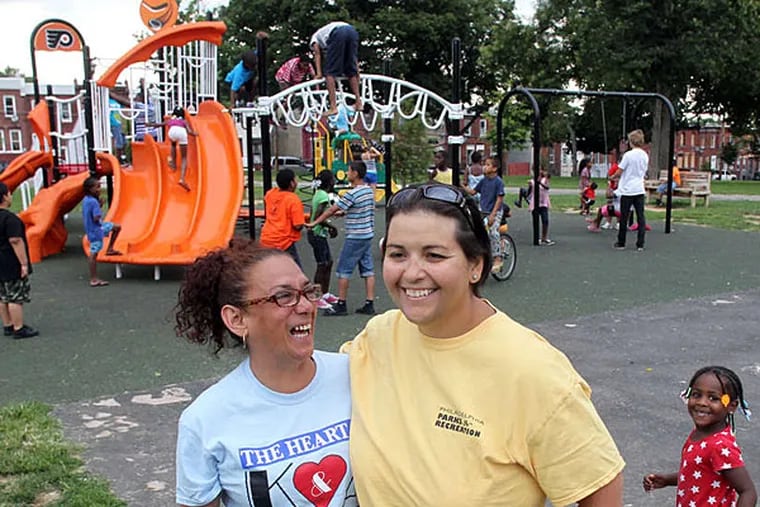 In Kensington are Awilda Ocasio (left), head of Friends of McPherson Square Park, and Patty-Pat Kozlowski of Parks & Recreation. &quot;We've come a long way,&quot; says Ocasio. (Yong Kim/Staff Photographer)