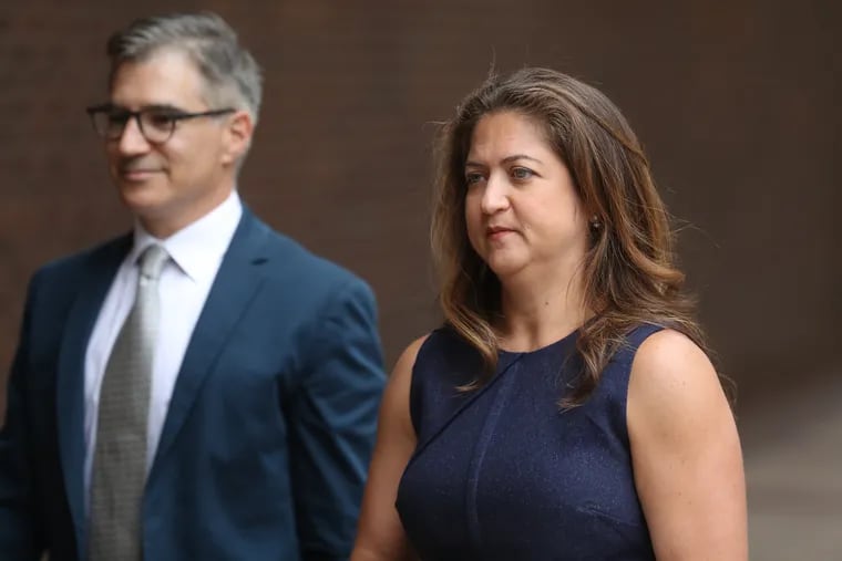 Cynthia Figueroa, commissioner of the Department of Human Services, enters Federal Court with Deputy City Solicitor Benjamin Field. The city is defending its suspension of foster care referrals to Catholic Social Services. The agency has sued alleging religious discrimination.