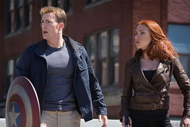 Here's your shield, what's your hurry?: Chris Evans and Scarlett Johansson in &quot;Captain America: The Winter Soldier.&quot; (Marvel Studios)