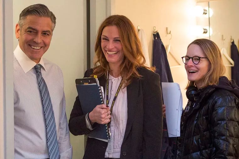 Brief encounter: The stars of "Money Monster," George Clooney and Julia Roberts, who were rarely on the set together due to scheduling issues, with director Jodie Foster (right). Foster, who received a star on Hollywood Boulevard on Wednesday, honoring her career as a director, has won two acting Oscars.