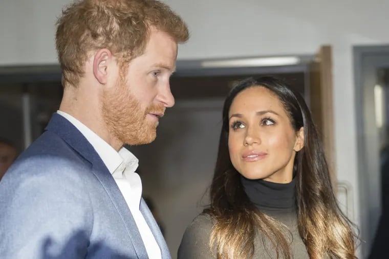 Prince Harry and his fiancee Meghan Markle speak with teachers at the Nottingham Academy Dec. 1.