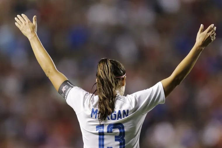 Alex Morgan scored two goals in the U.S. women's soccer team's rout of Trinidad and Tobago in World Cup qualifying.
