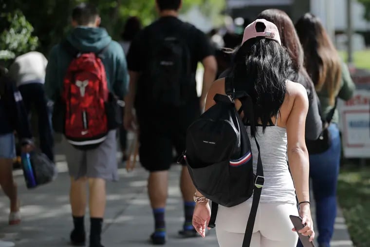 Students walk on the campus of Miami Dade College, in Miami in Oct. 2018. A report released Thursday, Feb. 14, 2019, by the Department of Education's independent Inspector General's office shows some borrowers weren't getting the guidance and protection they needed as they sought the best plan for paying off their student loans.