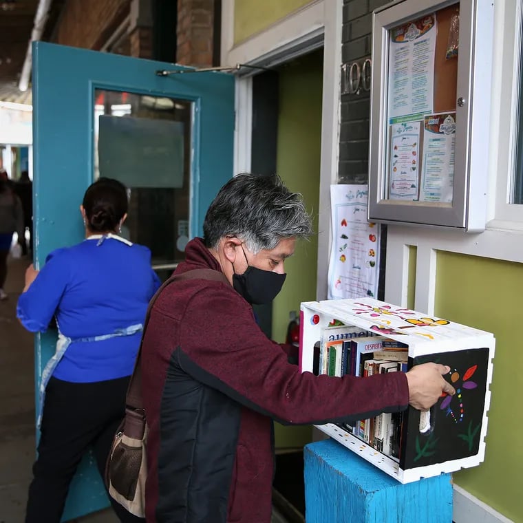 Edgar Ramírez of Philatinos Radio installs a Philibros bookshelf on a stand outside Alma del Mar in South Philadelphia on April 10, 2021. Ramírez is one of the organizers of the Philibros World Book Day celebration at the Mexican Cultural Center in Philadelphia on April 23, 2024.