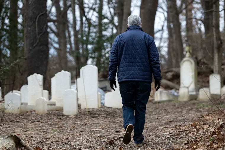 Neil Sukonik, walks along the Beth David’s  Jewish cemetery in Gladwyne, Pa. Monday December, 19, 2022. Neil along other board directors are working to revive the old cemetery and the grounds around it.