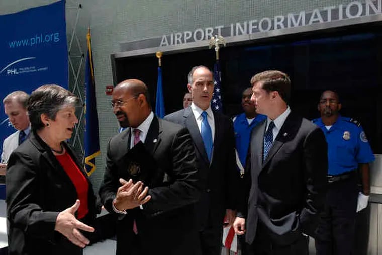 Homeland Security Secretary Janet Napolitano (left) joins Mayor Nutter, U.S. Sen. Bob Casey and U.S. Rep. Patrick Murphy after a news conference announcing the $26.6 million grant for baggage screening systems at Philadelphia International.