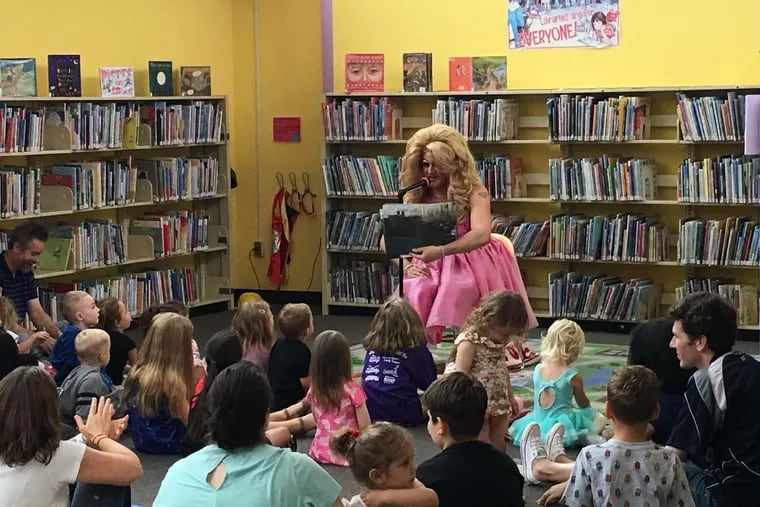 Brittany Lynn reads to children during a Drag Queen Story Hour