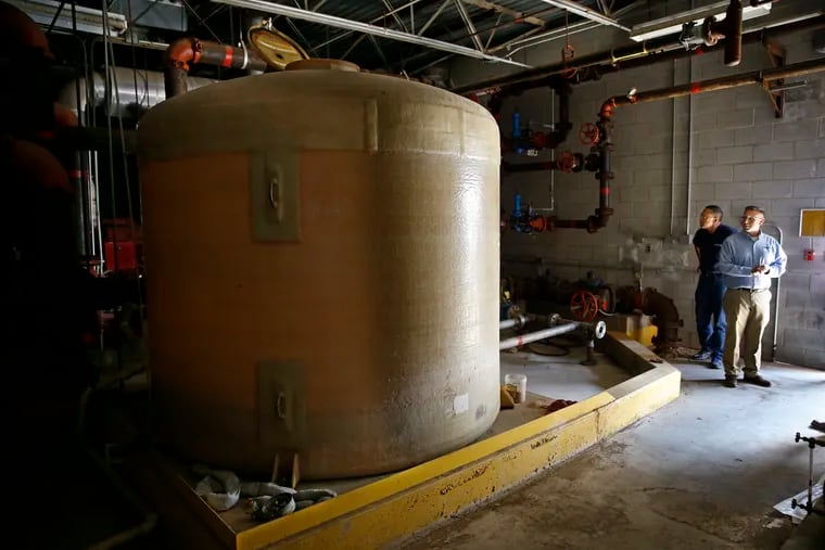 Empty tanks in a hangar at the former naval air base in Willow Grove once held concentrate that mixed with water to create the fire extinguishing foam that was used to put out fires on the base.