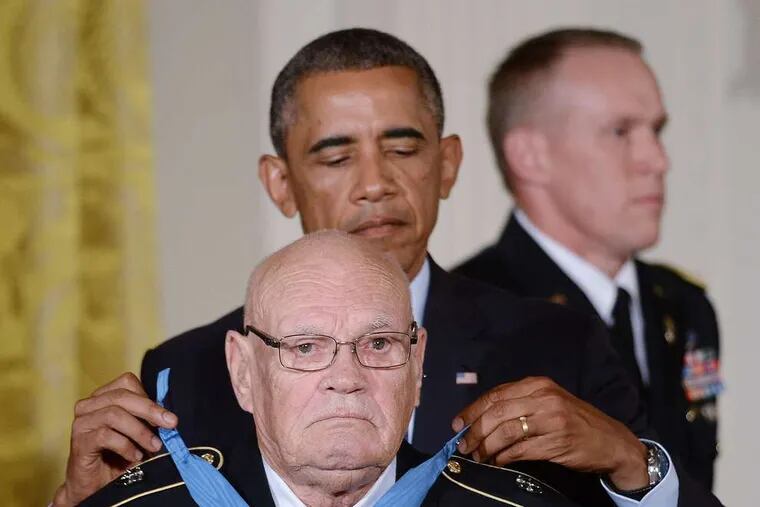 Command Sgt. Maj. Bennie G. Adkins receives the Medal of Honor from President Obama.