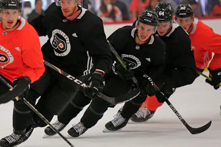 Kyle Criscuolo (51, middle) participating in a skating drill at training camp Saturday.