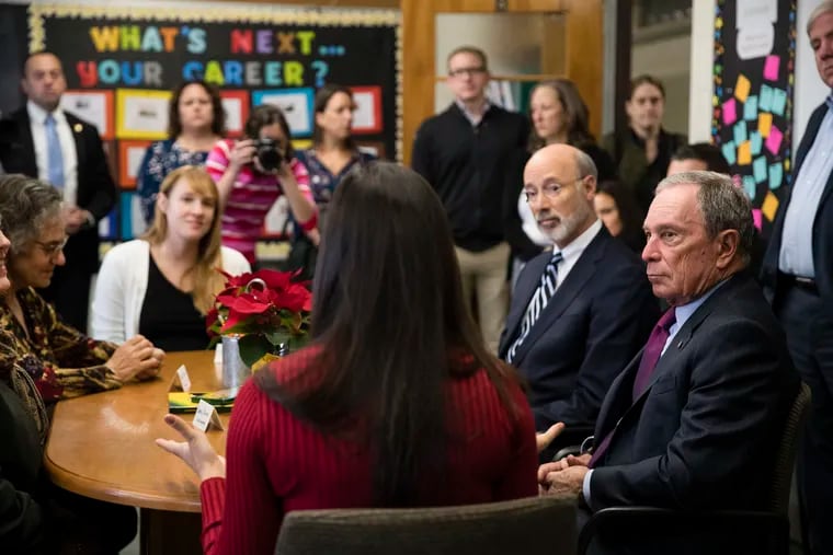 In this file photo from 2018, New York Mayor Michael Bloomberg (right) and Pennsylvania Gov. Tom Wolf (second from right) take take part in a discussion at the The Bridge Way School in Philadelphia, which serves students in grades 9 to 12 who are in recovery from substance abuse or addiction.