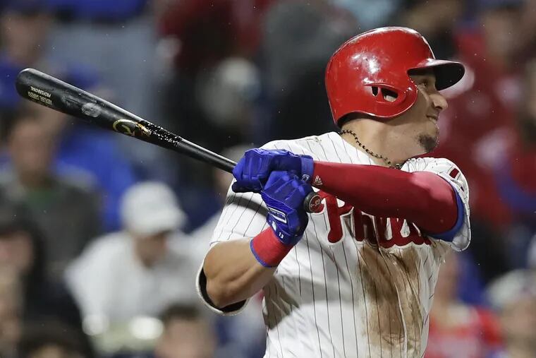 Phillies Asdrubal Cabrera watches his game winning tenth-inning home run to beat the Chicago Cubs 2-1 on Friday, August 31, 2018.