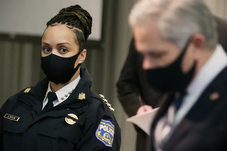 Philadelphia Police Commissioner Danielle Outlaw (left) listens as District Attorney Larry Krasner speaks during a news conference in a January 2021 file photograph.