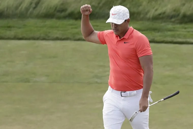 Brooks Koepka reacts after putting on the 14th green during the third round of the U.S. Open  on Saturday.