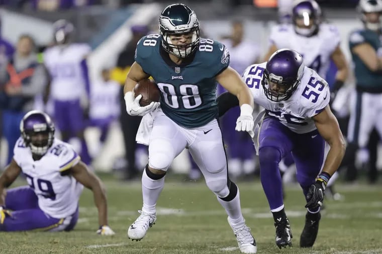 Eagles tight end Trey Burton runs with the football past Minnesota Vikings outside linebacker Anthony Barr during the third-quarter in the NFC Championship game on Sunday, January 21, 2018 in Philadelphia. YONG KIM / Staff Photographer