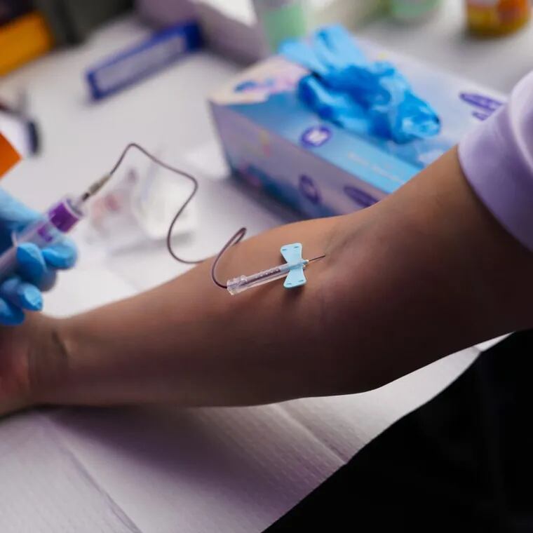 A patient has a blood sample drawn to be analyzed for various biomarkers.